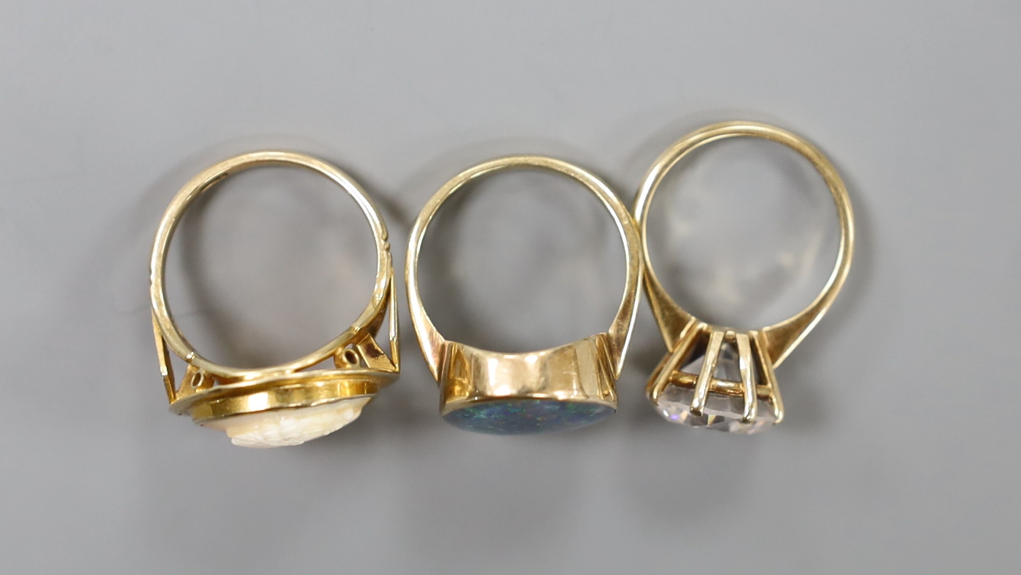 Three assorted modern 9ct dress rings, including cameo and simulated diamond, gross weight 16 grams.